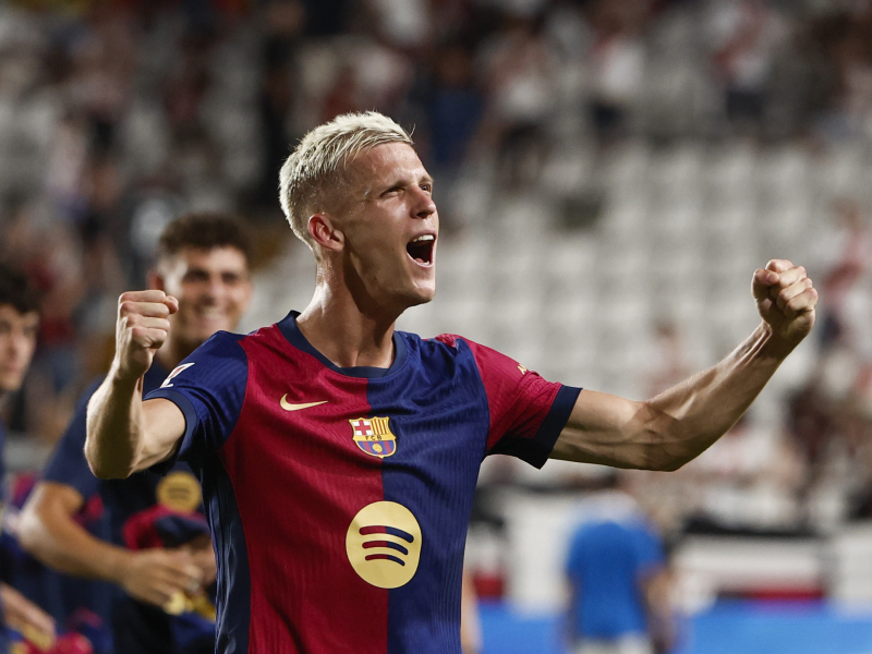 Dani Olmo celebrates his goal on his debut in Vallecas