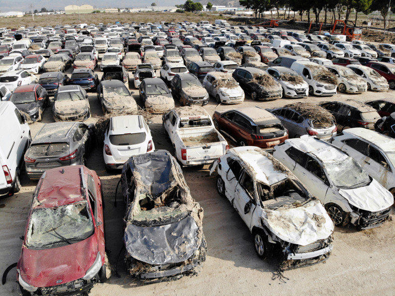 Aerial view new damaged cars due to flooding in dirt, spoiled can not be restored and used, gota fria September 2019, Orihuela