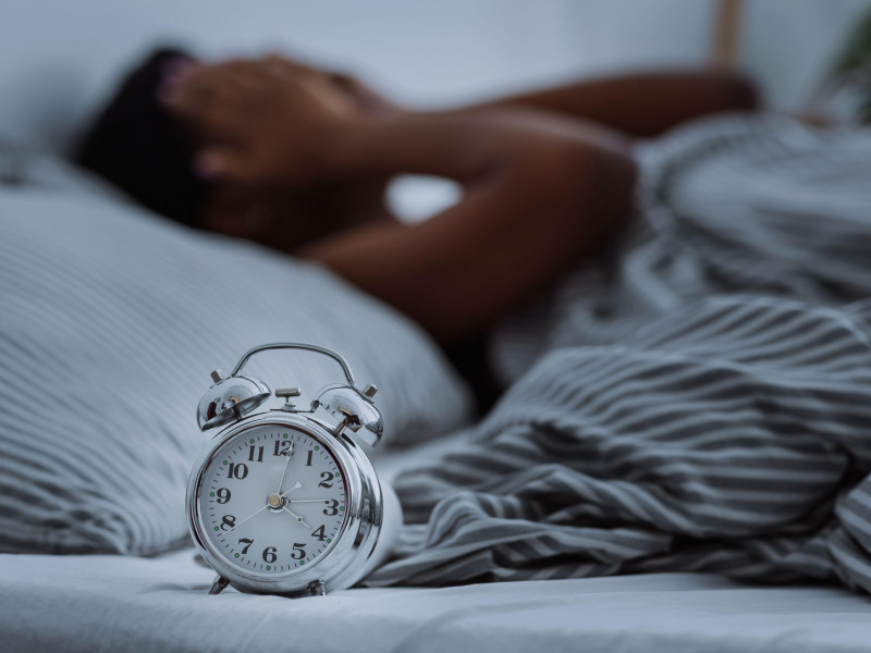 2BPG8KR African american woman suffering from insomnia lying in bed without sleep.
