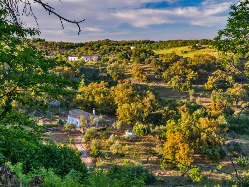 Farm houses at Sierra Norte de Sevilla Natural Park, Sierra Morena mountain range, near Cazalla de la Sierra, Sevilla province, Andalusia, Spain
