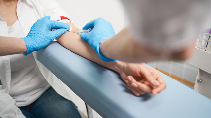 Medical checkup. Young patient visiting her therapist while doing health checkup, sampling blood for test
