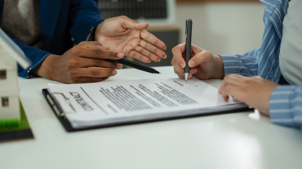 Considering buying a home, investing in real estate. Broker signs a sales agreement. agent, lease agreement, successful deal.