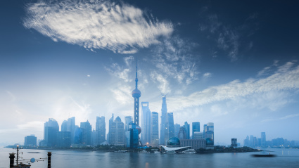 shanghai skyline in dawn against a blue sky