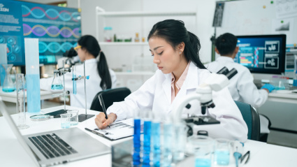 Modern medical scientists collaborate in a high-tech laboratory, analyzing chemical reactions and conducting precise experiments to advance healthcare and scientific research innovation