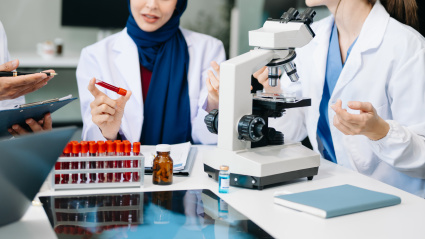 Scientist team meeting and writing analysis results in the laboratory study and analyze scientific sample