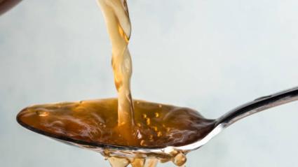 Apple Cider Vinegar Poured on a Spoo