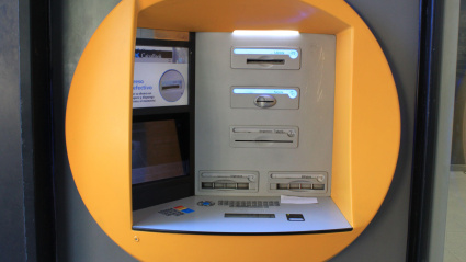2CTDWRF CaixaBank ATM in Madrid (Spain). Caixabank and Bankia merge, creating the largest bank in Spain. / Ana Bornay