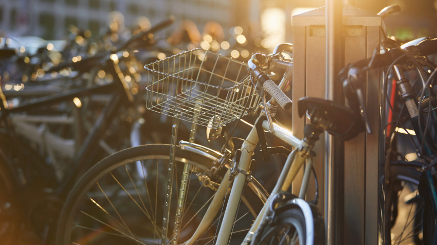 Public bicycle parking at city street at sunset. Zurich, Switzerland.