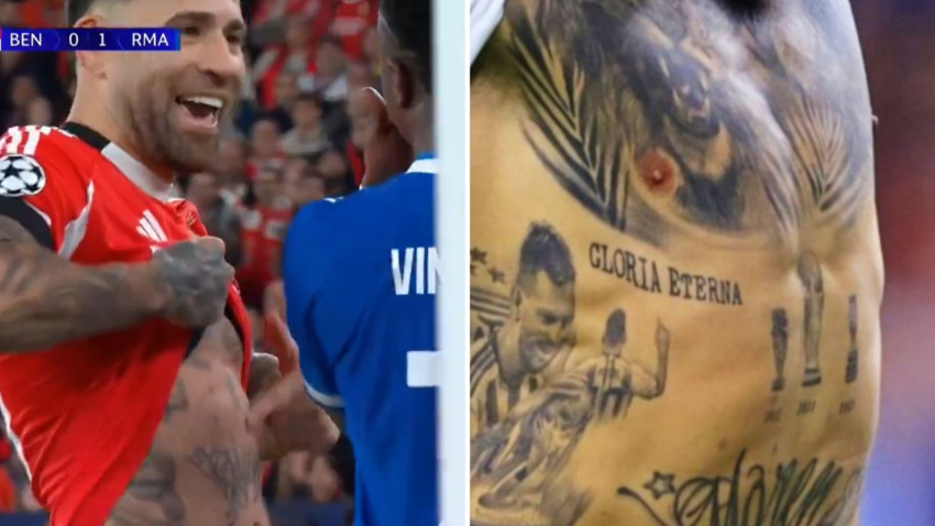 Otamendi enseñando su tatuaje del Mundial de fútbol a Vini Jr