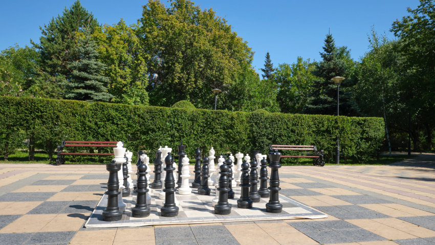 2KFECR1 A giant chessboard game, set in a park with a theme of chess, games. In Astana, Nur Sultan, Kazakhstan.