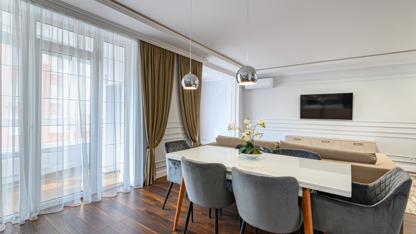 Grey and white contemporary classic kitchen interior designed in modern style being a part of studio apartment