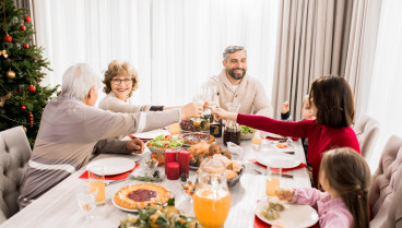 R4FYAW Family Enjoying Christmas Dinner