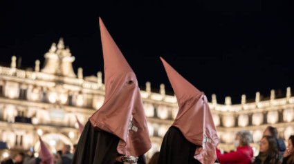 SALAMANCA, SPAIN - APRIL 13, 2022: Holy Week procession of flagellants from catholic brotherhood before Easter