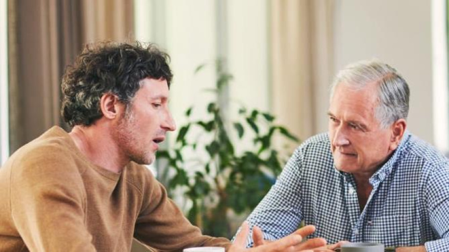 Shot of a mature man and his elderly father having coffee and a chat at hom