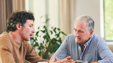 Shot of a mature man and his elderly father having coffee and a chat at hom