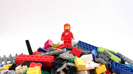 Colorado, USA - April 7, 2015: Studio shot of Lego astronaut on bricks. Legos are a popular line of plastic construction toys manufactured by The Lego Group, a company based in Denmark