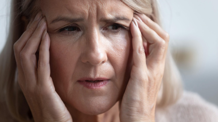 2B8P5K8 Unhealthy mature retired woman suffering from strong sudden headache.