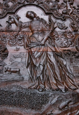 Santa Eulalia regando los campos, en la puerta principal de la Catedral