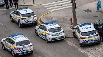 Cuatro coches patrulla con varios agentes.Palma de Mallorca