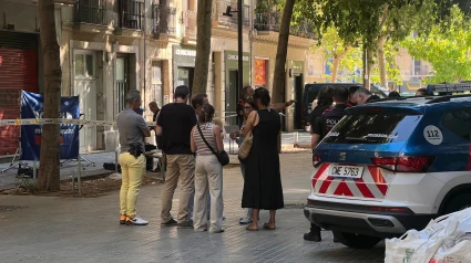 en la Calle Consell de Cent de Barcelona, después del tiroteo con una víctima mortal