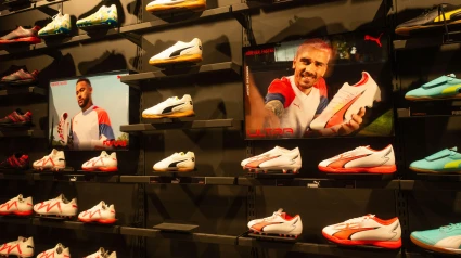2RXXHW4 Puma football boots store, shop display with images of sponsored footballers, Neymar and Antoine Griezmann
