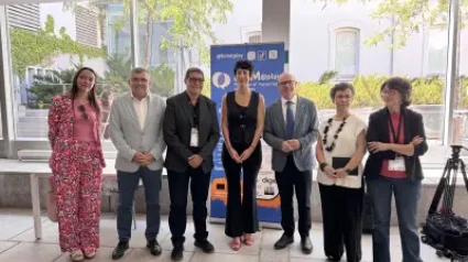 El rector y la ministra de Inclusión, Seguridad Social y Migraciones