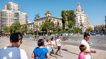 2A6M7GK Valencia Spain,Carrer de Xativa,view of Casa del Chavo,National Pension Institute building,clock,tower,exterior,Instituto Lluis Vives,dome,pedestrians