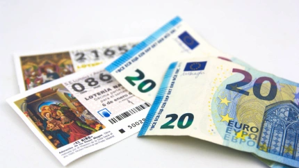 WTKNN0 WTKNN0 2019. Spain. Some euro bills on some tickets for the draw for the national Christmas lottery.