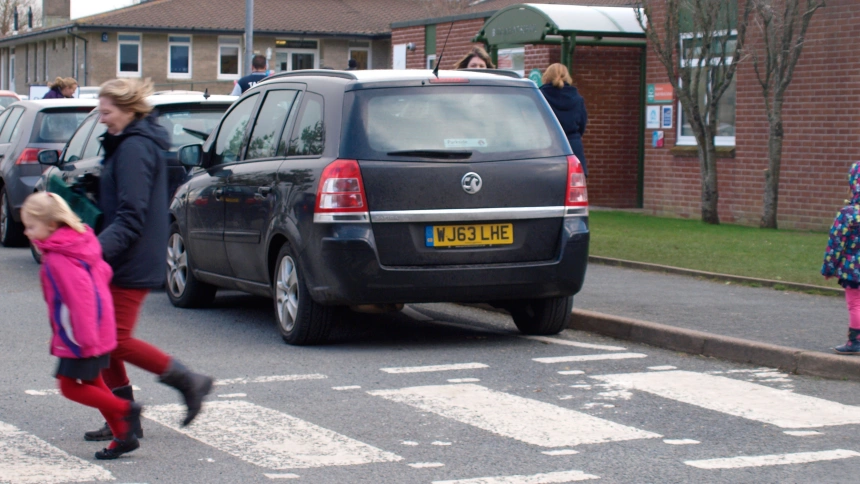 DT7HDT Cars parked dangerously close to zebra crossing outside a school.. Image shot 02/2014. Exact date unknown.