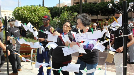 Acto organizado por Cáritas con personas sin hogar