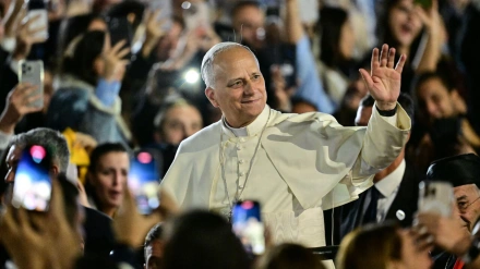 Pope Leo XIV waves to a crowd of youths upon his arrival at the Maronite Patriarchate in Bkerke, north of the capital Beirut, on December 1, 2025. Leo prayed for peace in Lebanon and the region on December 1 on day two of his trip to the multi-confessional country, with joyful Lebanese welcoming the pontiff at two famous pilgrimage sites. (Photo by Giuseppe CACACE / AFP)