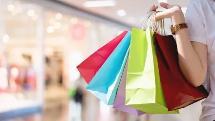 Closeup of woman holding shopping colorful of shopping bags at shopping mall with copy space - Shopping Concept