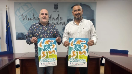 Amando Guerrero e Ibán Santalla con el cartel de la prueba