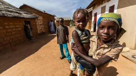 HXEXAP Proud Fulani mother shows her baby in a small village close to Kaduna, Nigeria.