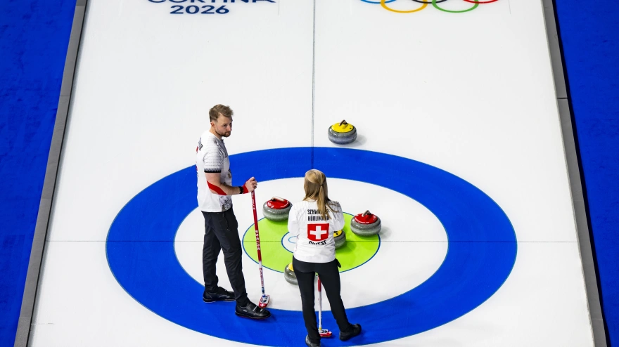 Cortina d'Ampezzo (Italy), 04/02/2026.- Yannick Schwaller of Switzerland and Briar Schwaller-Huerlimann of Switzerland talk during the curling mixed doubles round robin game between Switzerland and Estonia at the Cortina Curling Olympic Stadium prior to the Milano Cortina 2026 Winter Olympic Games in Cortina d'Ampezzo, Italy, 04 February 2026. (Italia, Suiza) EFE/EPA/JEAN-CHRISTOPHE BOTT