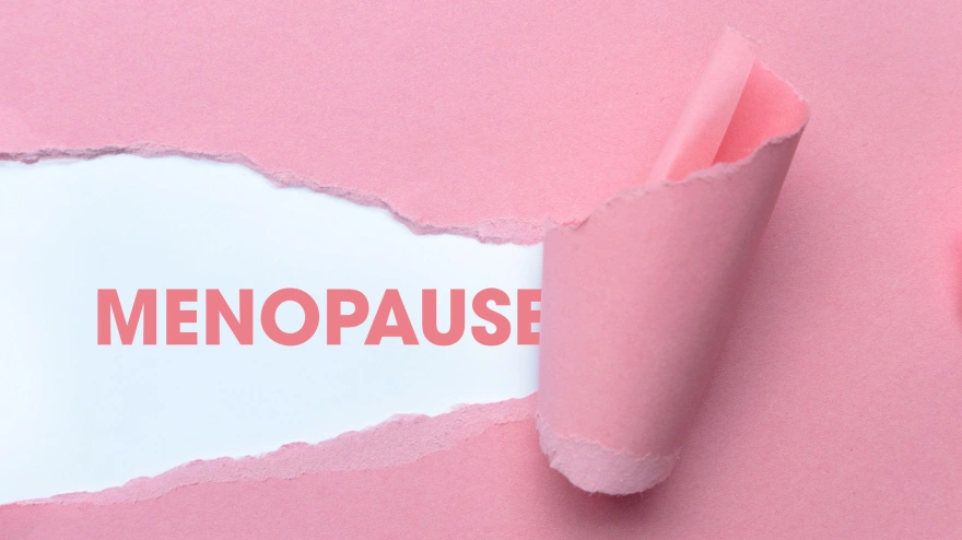 Papel rosa con la palabra «menopausia»