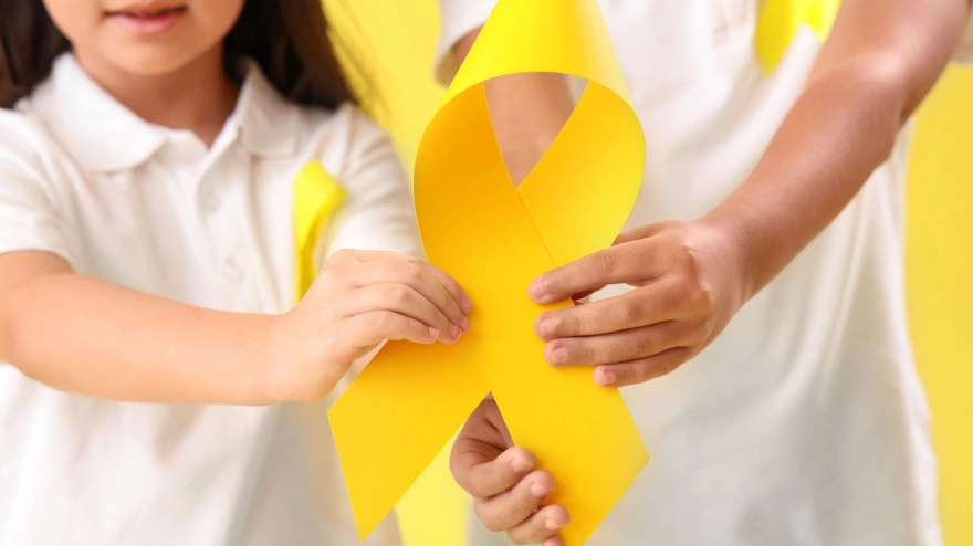 Lazo amarillo, símbolo del cáncer infantil
