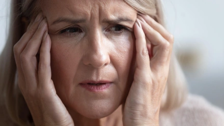 2B8P5K8 Unhealthy mature retired woman suffering from strong sudden headache.